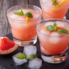 Grapefruit cocktail with ice and mint.