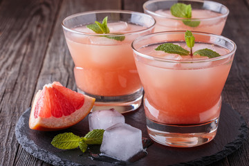 Grapefruit cocktail with ice and mint.
