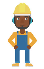 Man wearing hard hat and headphones 