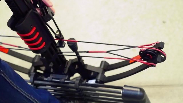 Handsome man with a bow and arrowss shoots with a crossbow in the dash. 1920x1080