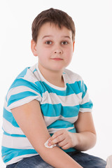 Doctor giving a child injection in arm on isolated image.