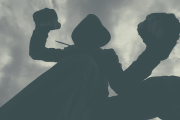 Violent attack, unrecognizable male criminal kicking and punchin