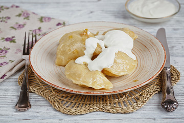 Vareniki with onion and sour cream