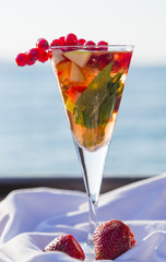Fruit punch in glass by the seaside