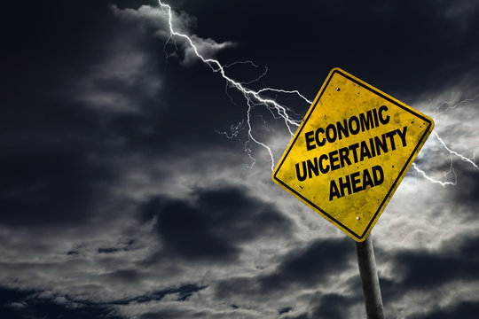Economic Uncertainty Sign With Stormy Background and Copy Space