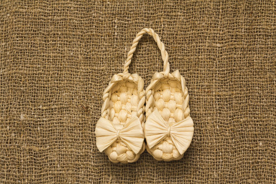 souvenir Old Russian sandals made of bark on a Brown background