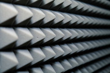 Dampening acoustical foam on recording studio wall