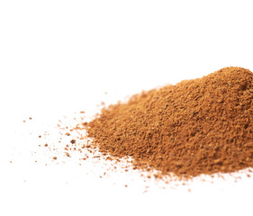 Pile of cinnamon powder isolated