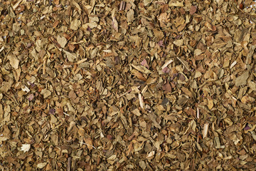 Surface covered with dry basil