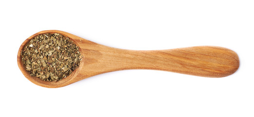 Wooden spoon and dried basil