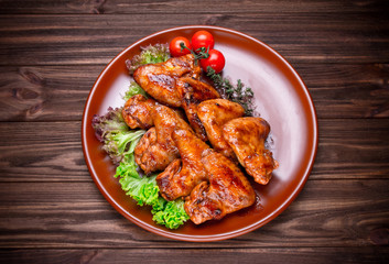 Grilled chicken wings with vegatables and seasoning