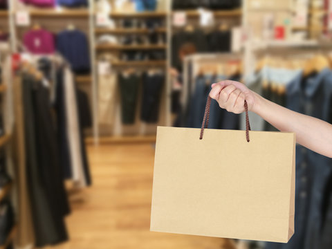 Woman with shopping bag in store