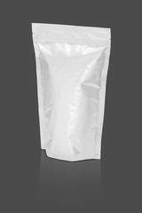 blank packaging aluminium foil pouch isolated on gray background