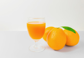 Orange and orange juice with white background