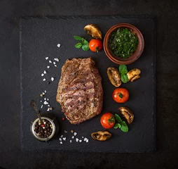 Aluminium Prints Steakhouse Juicy steak medium rare beef with spices and grilled vegetables. Top view