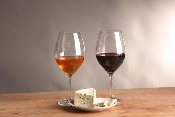 wine bottle and wine glass on a glass table