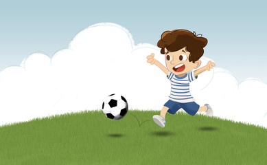 Niño jugando al futbol en el parque. Corre tras la pelota en un campo de cesped © malosdedos