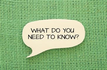 What do you need to know message on bubble speech shape sticky note on burlap