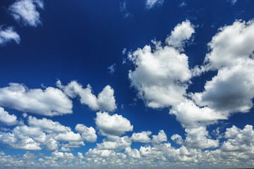 Blue sky with clouds and sun