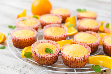 Tasty muffins with oranges and mint