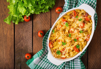 Pasta casserole, tomato, bacon and cheese. Top view