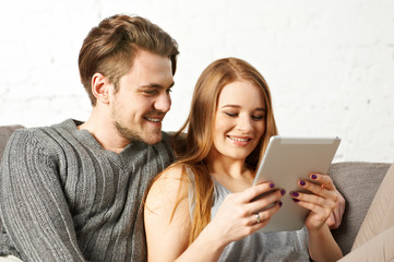 Young couple using a tablet computer 