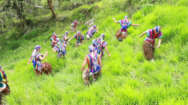 Experience the vibrant beauty of Ecuadorian culture as twelve dancers gracefully perform a traditional outdoor dance,adorned in stunning traditional costumes.