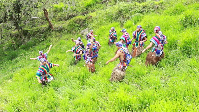 Experience the vibrant beauty of Ecuadorian culture as twelve dancers gracefully perform a traditional outdoor dance,adorned in stunning traditional costumes.