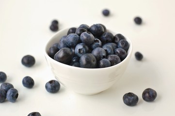 Blueberries in the bowl on the white background