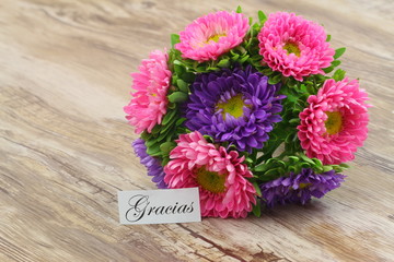 Gracias (thank you in Spanish) card with colorful daisy flower bouquet
