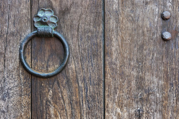 The metal ring on a wooden door