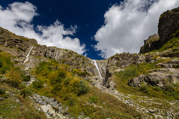 Fototapeta premium Waterfall under Ushba glacier in Mazery valleyin Georgia