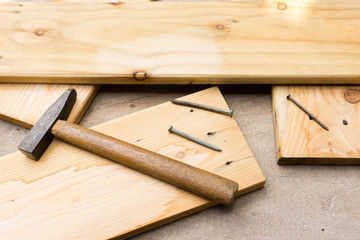Hammer and nail on wood
