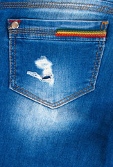 Blue jeans fabric texture close up, trims, seams, pockets