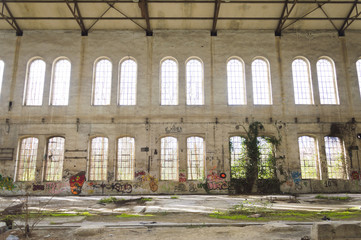 Facade with graffiti of an old factory