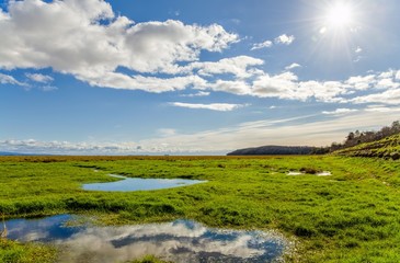 Obraz premium Clouds over fields, Grange-over-sands, Cumbria, England 