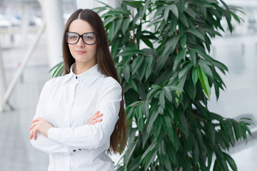 Confident friendly business woman in glasses