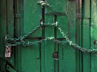 Old doorknobs, doorknockers and handles on ancient doors