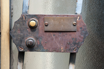 Old doorknobs, doorknockers and handles on ancient doors