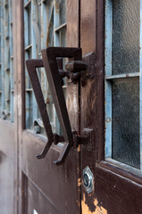 Old doorknobs, doorknockers and handles on ancient doors