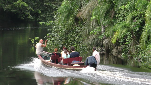 crowd of travelers navigation on cuyabeno waterway in ecuadorian amazonia raft tour kayak wildlife drive amazon tourist canoe vacation flow nature river rainforest activity group ecuador amazonia jun