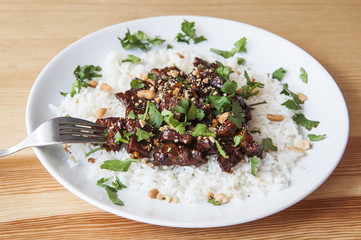 Asiatic dish: Stir fried pork with walnuts and white rice