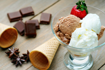 Ice cream sundae, waffle cone and chocolate pieces