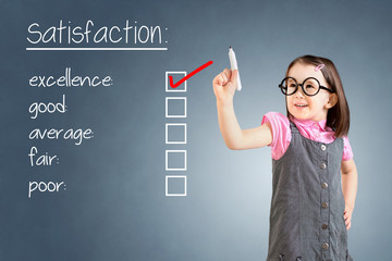 Cute little girl wearing business dress and checking excellence on customer satisfaction survey...