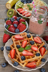 Waffles with berries and caramel sauce