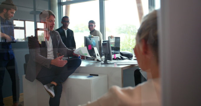 Startup business man discussing work with team in office