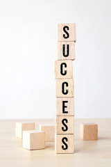 Success word on wooden cubes