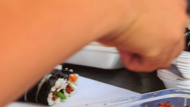 Hands Cut Sushi with Knife Put into Lunch-Box