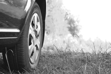Car wheel closeup. Black and white photo. Modern style.