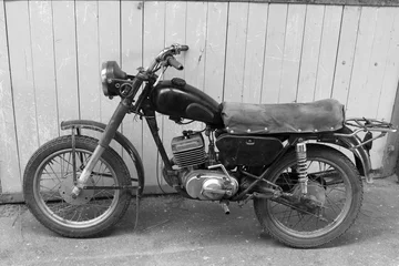 Schilderijen op glas Retro motorcycle. Black and white photo. Old vintage card. © yarbeer